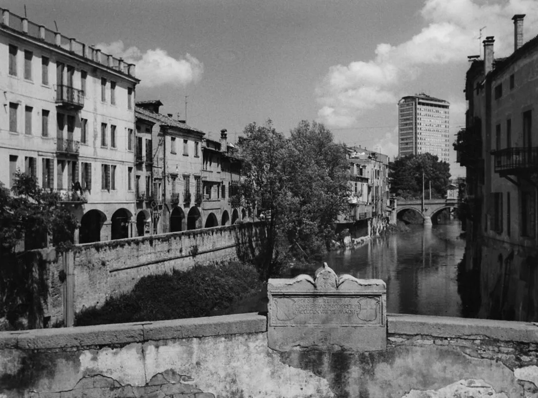 Ponte Molino and the canal in Padova in 1967, arcaded houses along the water